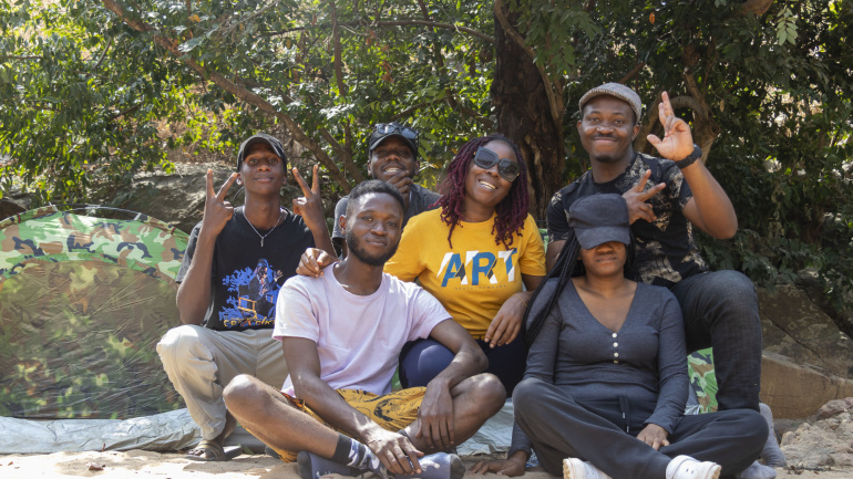 Campers from Crossover Camp Season 1 smiling and posing together at Gurara Waterfalls, Niger State